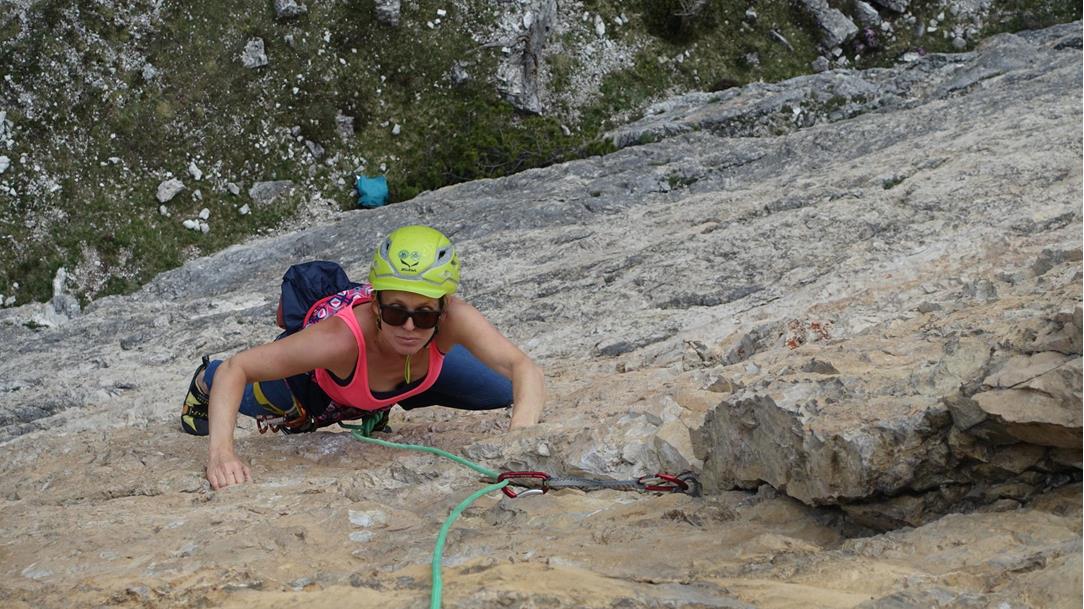 Claudia climbing in the Dolomites