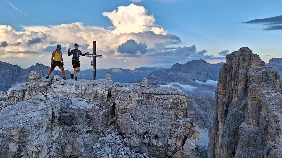 Two women at the peak cross