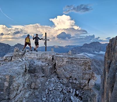Two women at the peak cross