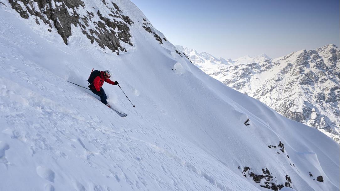 A man is skiing down